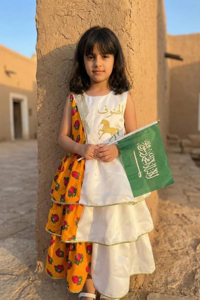 Girls' white and orange shalky dress with an elegant traditional design for Ramadan — product image 1