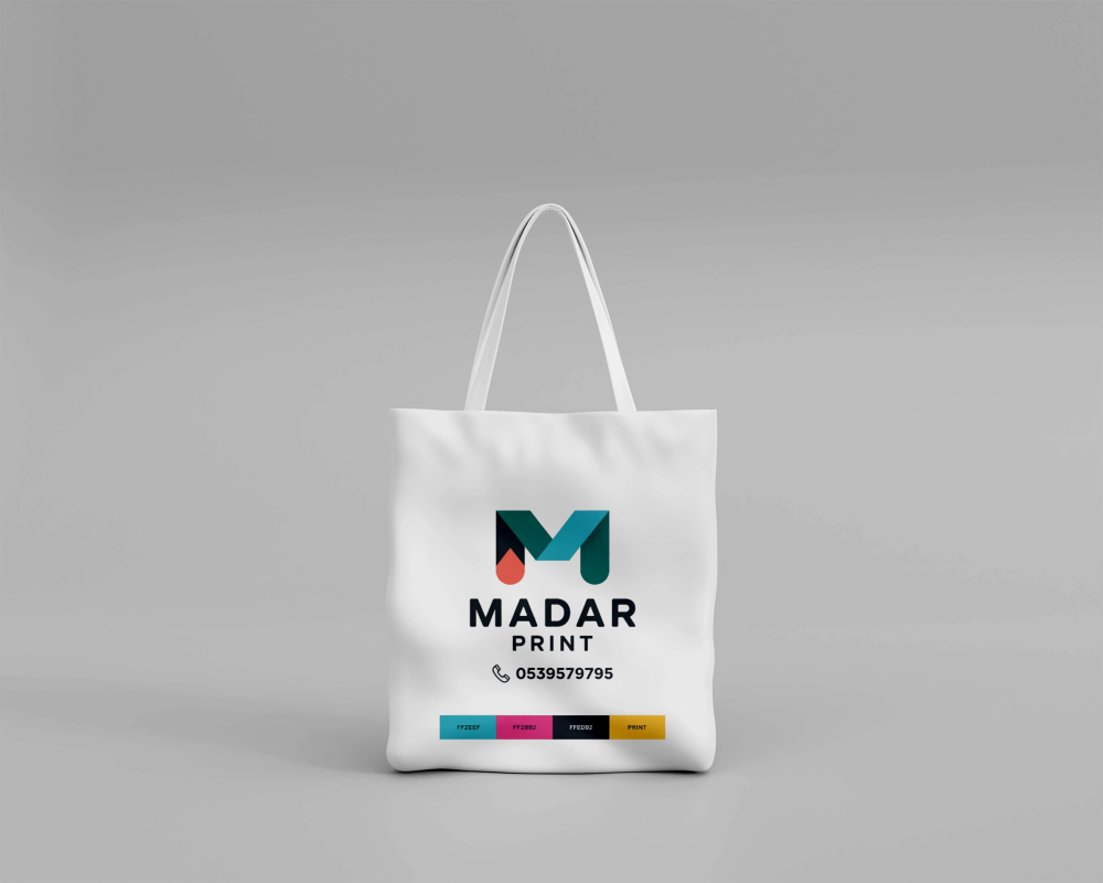 White tote bag with 'Madar Print' branding on a gray background