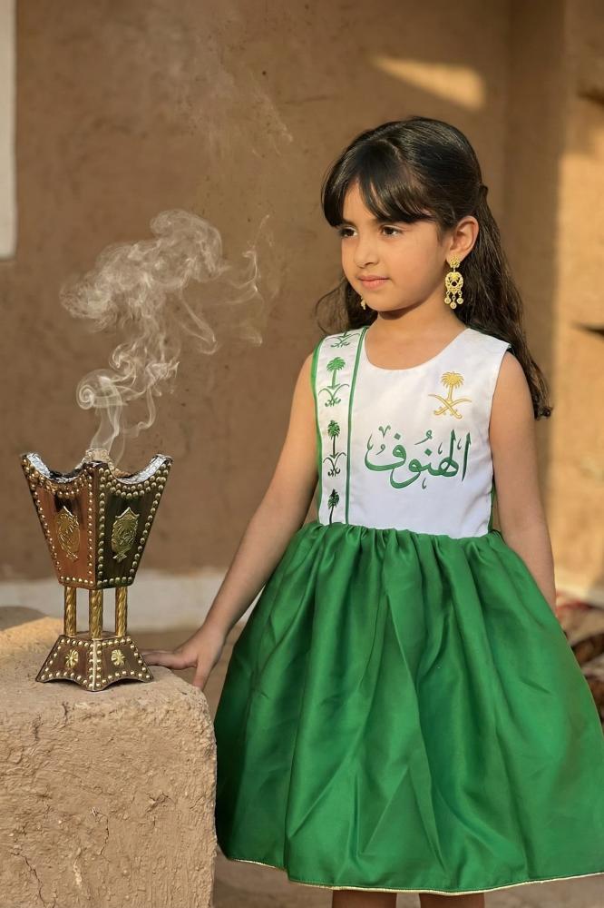 Green and white National Day dress with embroidery of two swords and a royal palm tree for girls — product image 1