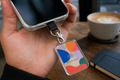 Custom printed 3 mm acrylic rectangle phone charm with metal clasp and fabric tether