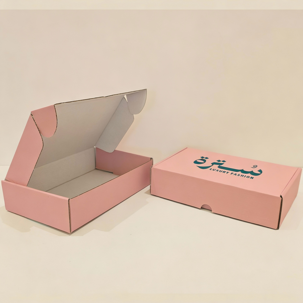 Boîte d'expédition en carton ondulé rose sur mesure 27x18x6,5 cm avec logo 1 couleur