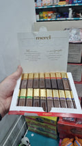 Boîte de chocolats Merci Finest Selection avec assortiment de saveurs et emballage doré, parfaite pour offrir.