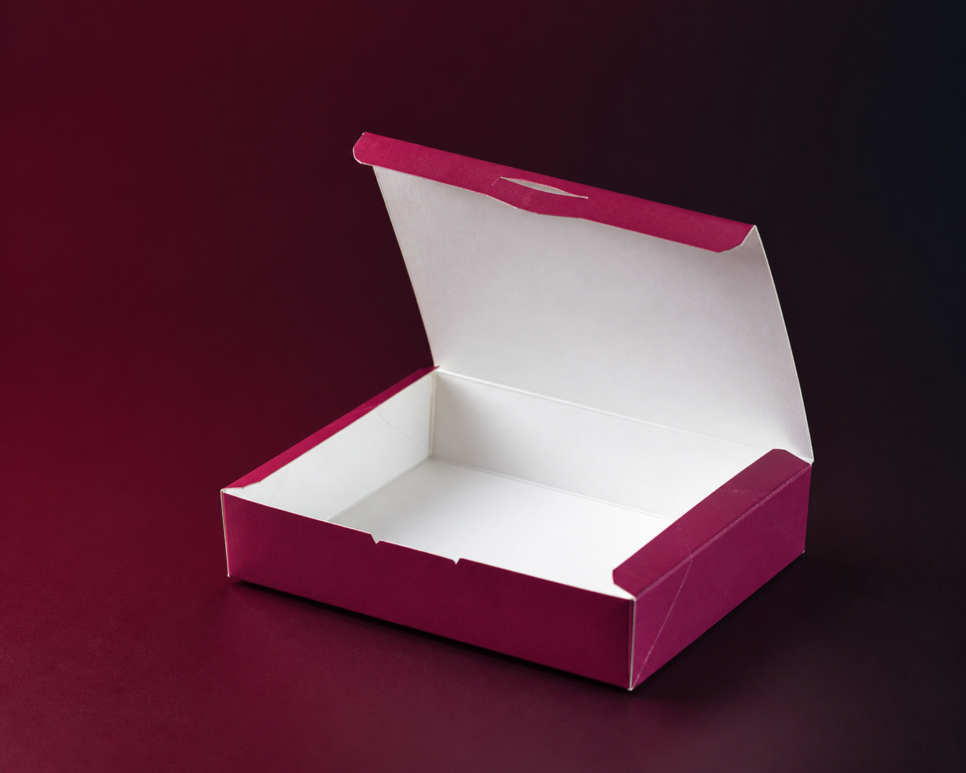 Open empty burgundy basbousa box shown from a different angle