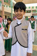 A plain gray blazer for boys with a Saudi stand-up collar and a curved cut, with a golden pulse brooch — product image 1