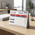 Premium corporate desk calendar displayed on minimalist wooden desk in modern office setting, emphasizing professional branding.