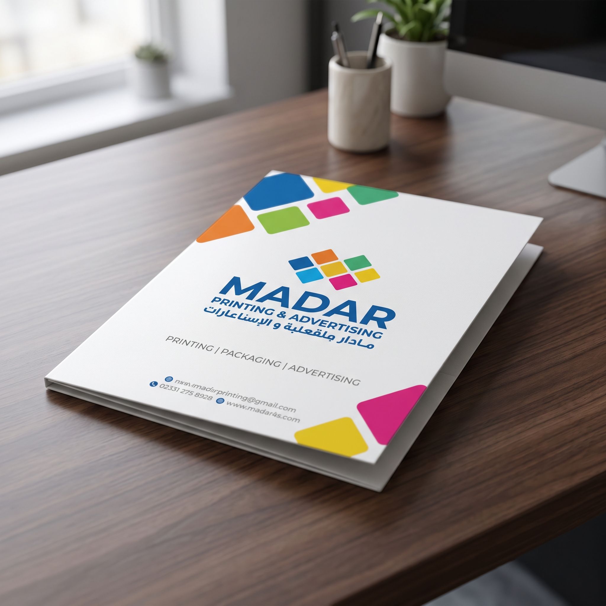 Close-up of minimal design custom presentation folder from Madar Print on a dark wooden surface, showcasing crisp edges and matte finish.