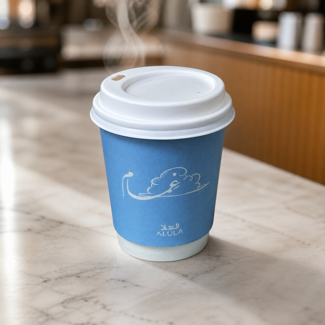 Custom printed paper cup with lid in a cafe setting
