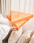 Stacked custom printed orange catering boxes with separate full-cover lids