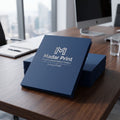 Photorealistic image of luxury finish presentation folders by Madar Print on a wooden desk in a professional office setting.