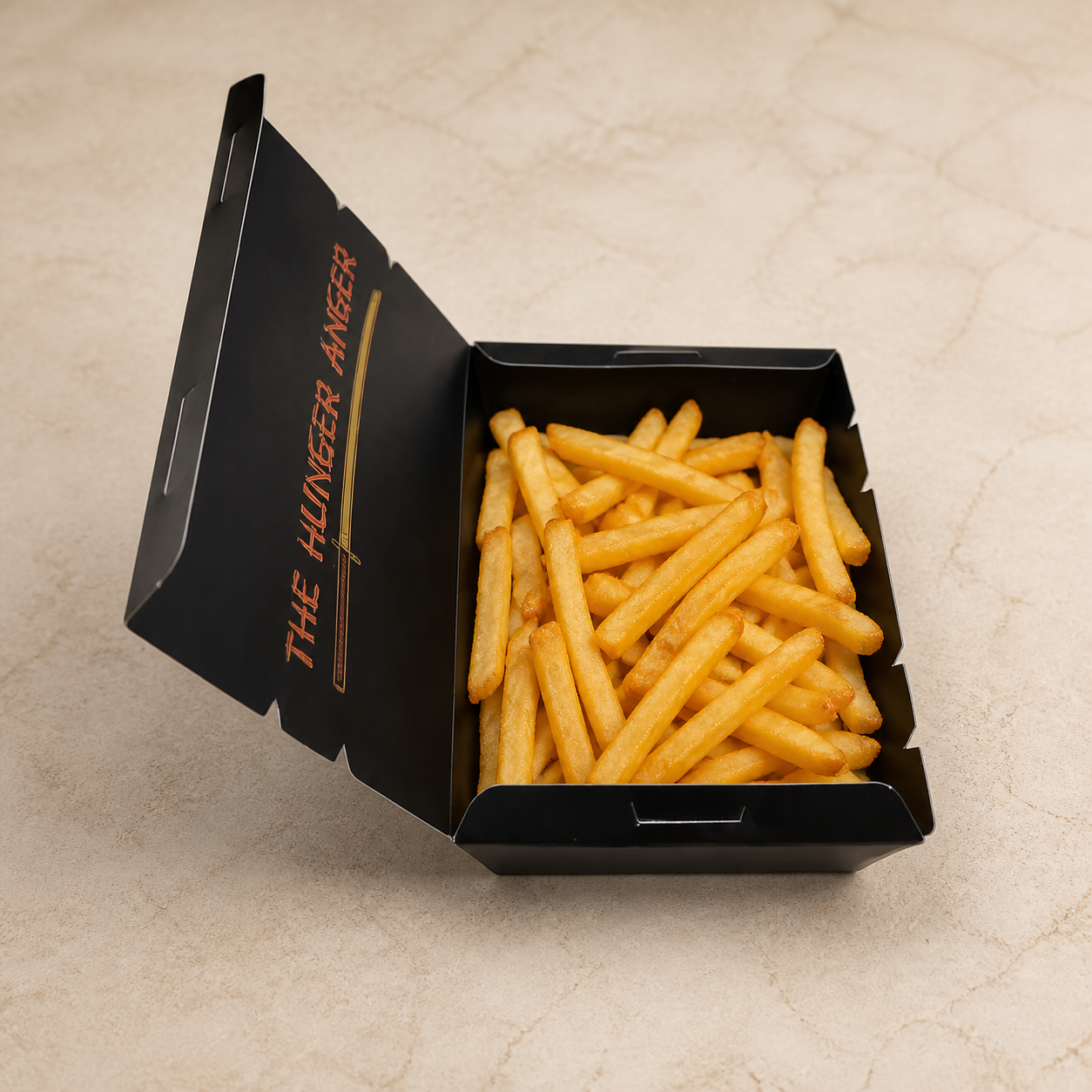 Open black pyramid takeaway potato box filled with golden French fries